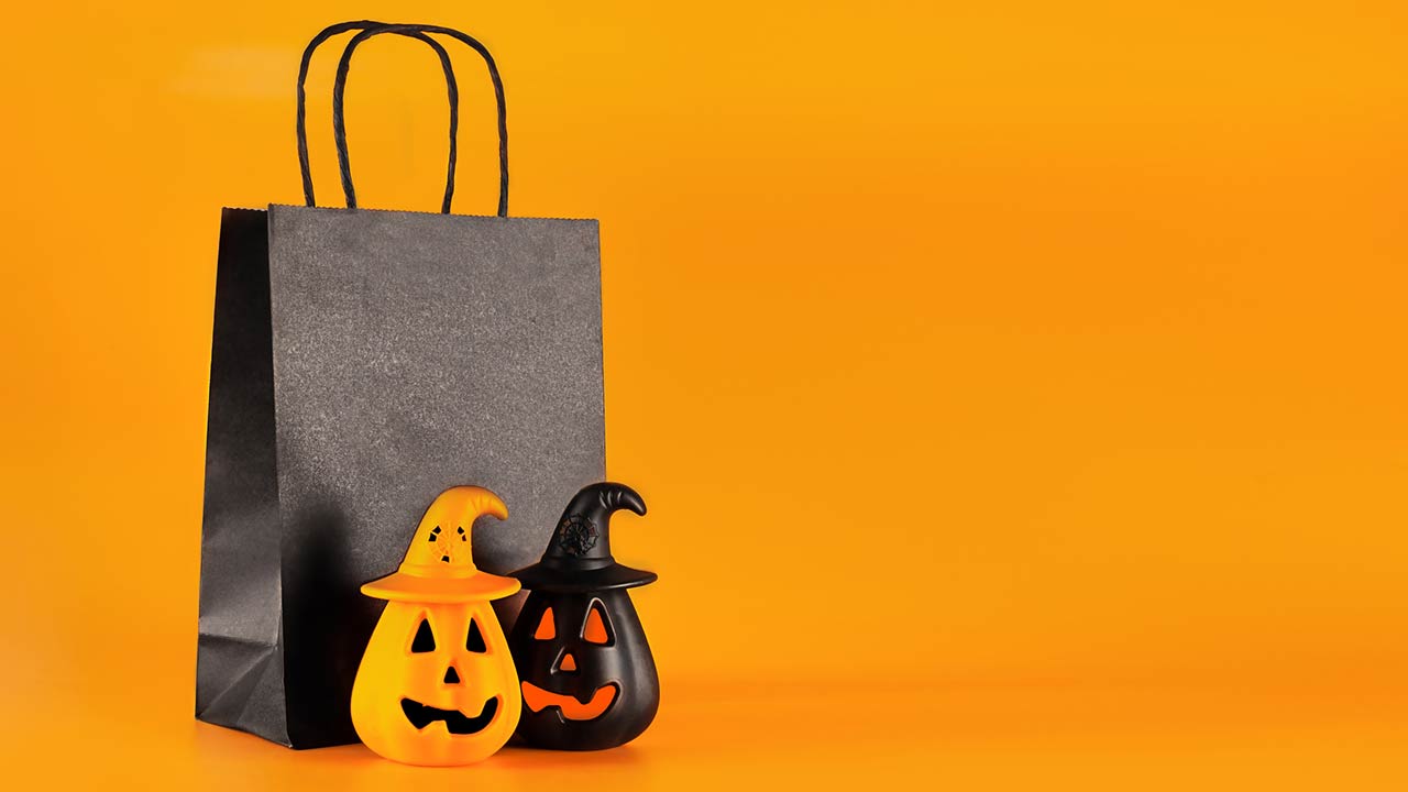 Photo of scary Halloween pumpkins and a gift bag