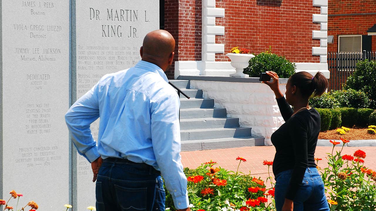 Photo of Selma, AL, USA September 14, 2011 An African American family stops at the Brown Chapel AME Church in Selma Alabama