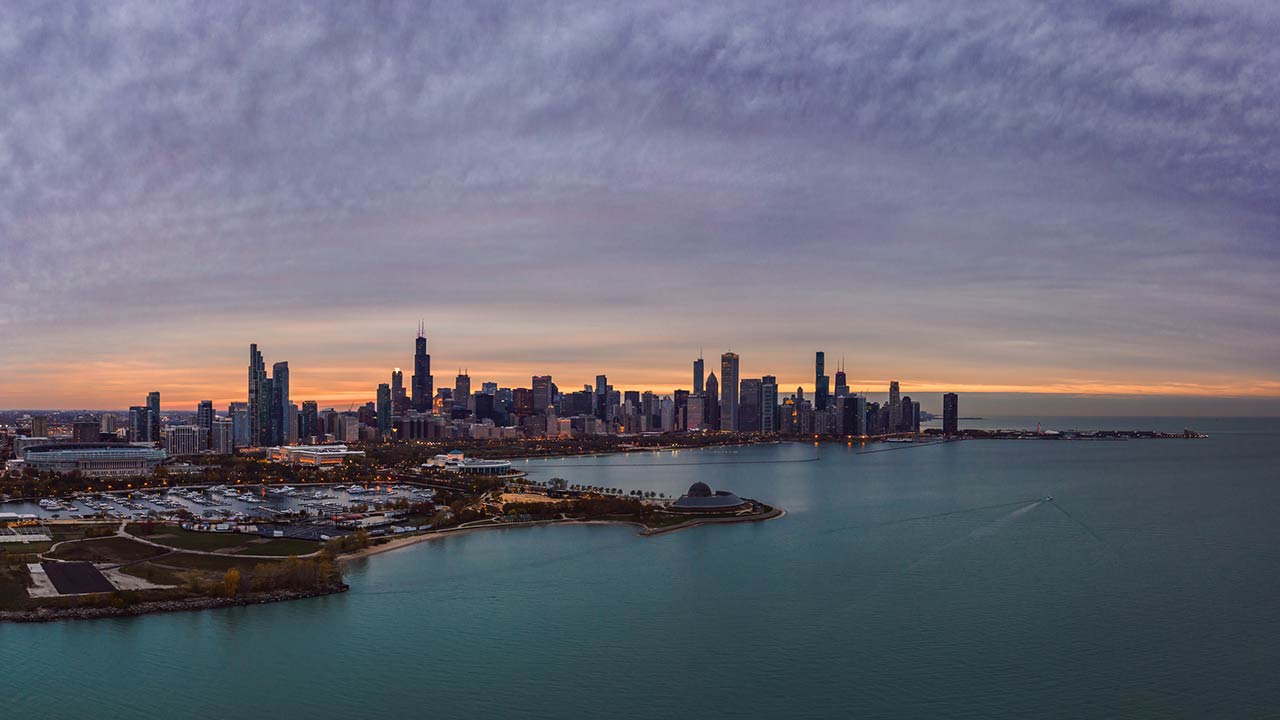 Wide angle photo of Chicago city skyline aerial panorama with Northerly Island and Lake Michigan in foreground