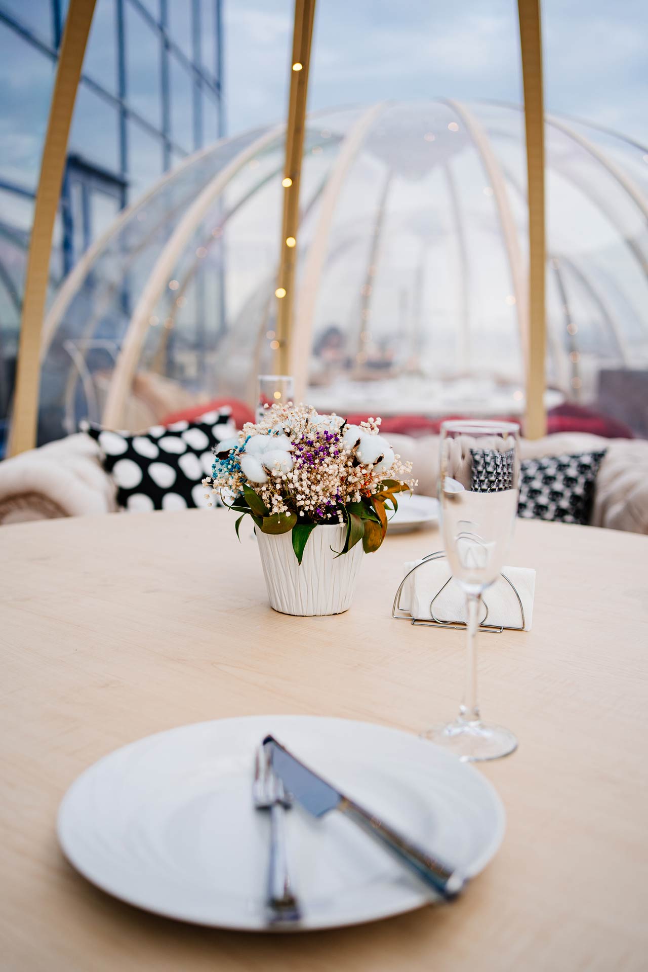 Photo of a served table in a cafe on the roof in the form of a igloo