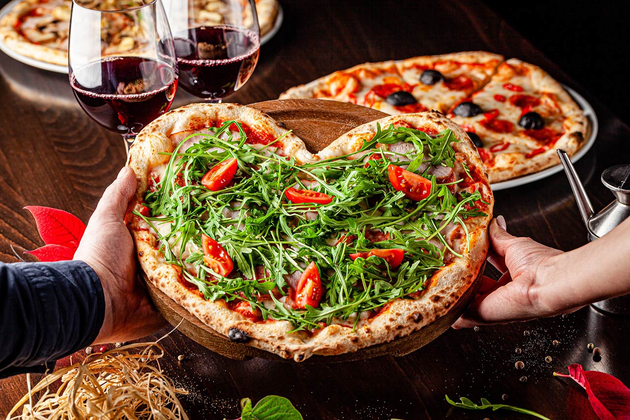 Photo of a pizza for Valentine's Day for lovers in the form of a heart