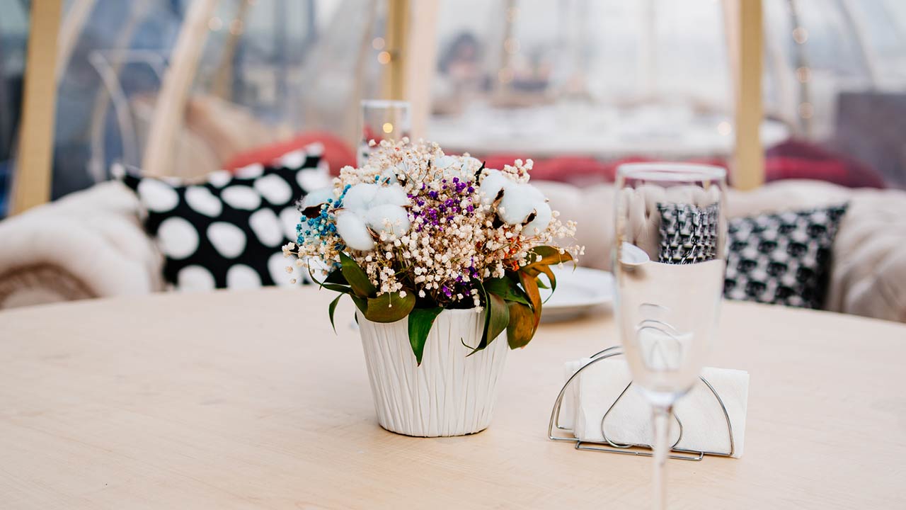 Photo of a served table in a cafe on the roof in the form of a igloo