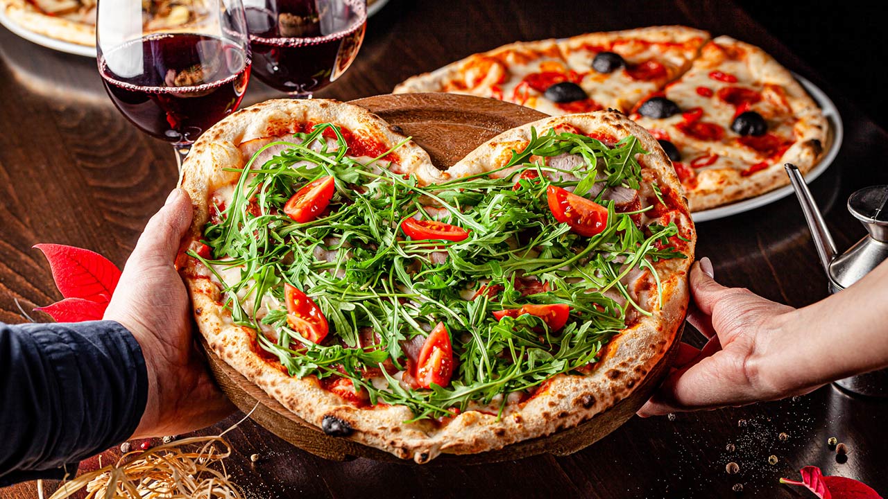 Photo of a pizza for Valentine's Day for lovers in the form of a heart