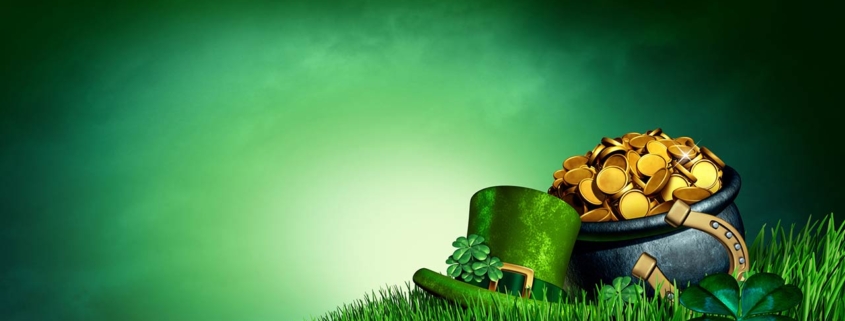 Clover leaves a pot of gold and lucky horseshoe on grass as a 3D illustration