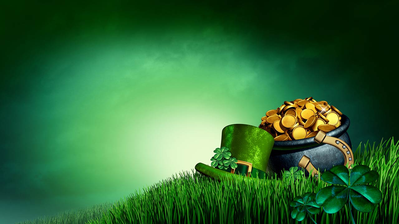 Clover leaves a pot of gold and lucky horseshoe on grass as a 3D illustration