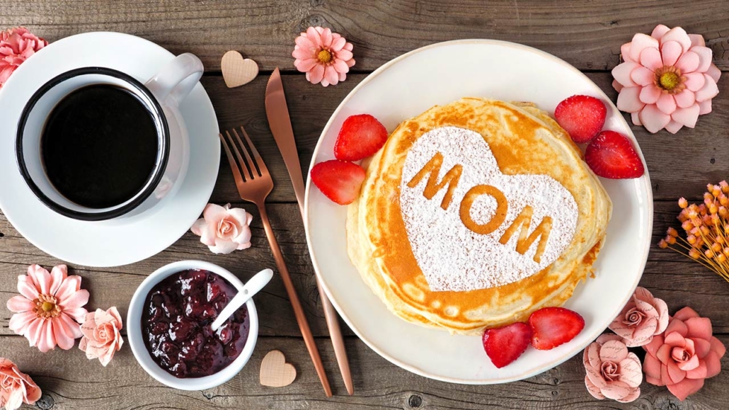 Pancakes with heart shape and MOM letters