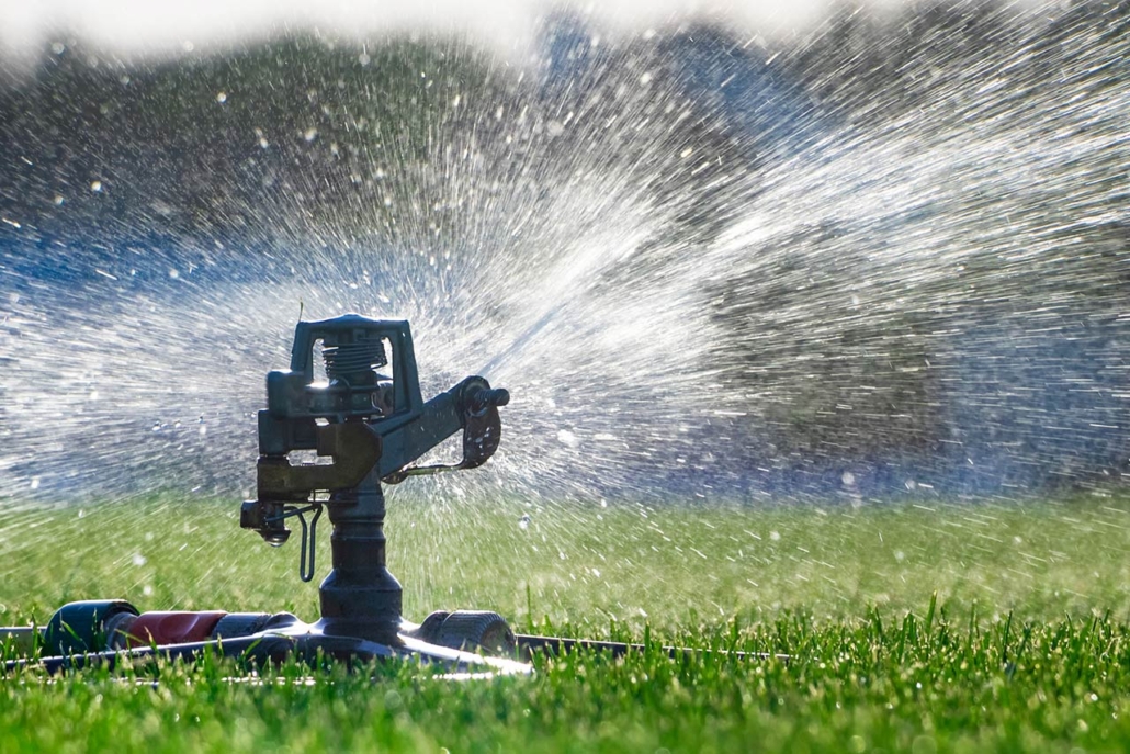 Automatic sprinkler system watering the lawn