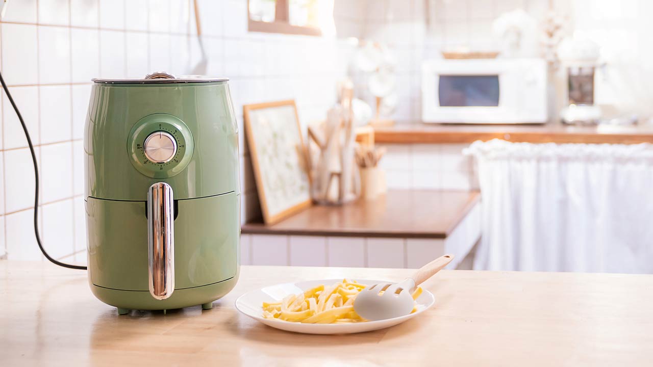 Air fryer machine cooking potato fried in kitchen home