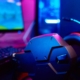 PC with rgb keyboard and headphones for gaming computer video games with neon colored background