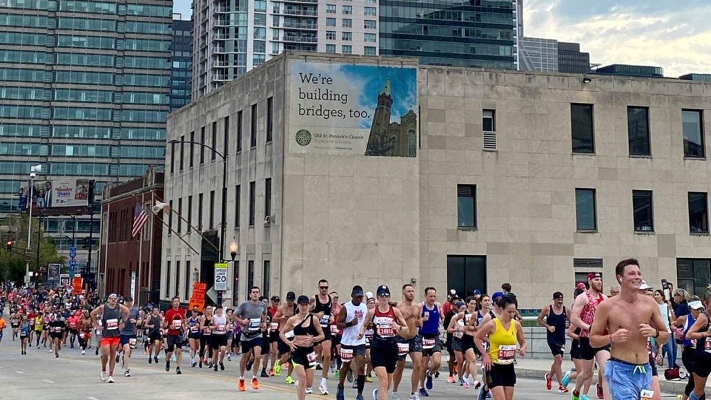 Bank of America Chicago Marathon runners race down Monroe Street after leaving the downtown loop