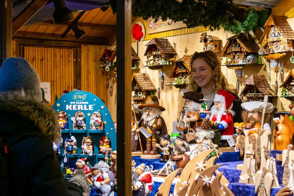 Shopkeeper selling Christmas-themed goods at the Christkindlmarket at the Daley Plaza in Chicago