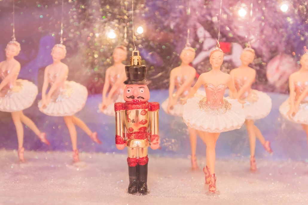 Christmas Nutcracker toy soldier and balerina dolls on the stage