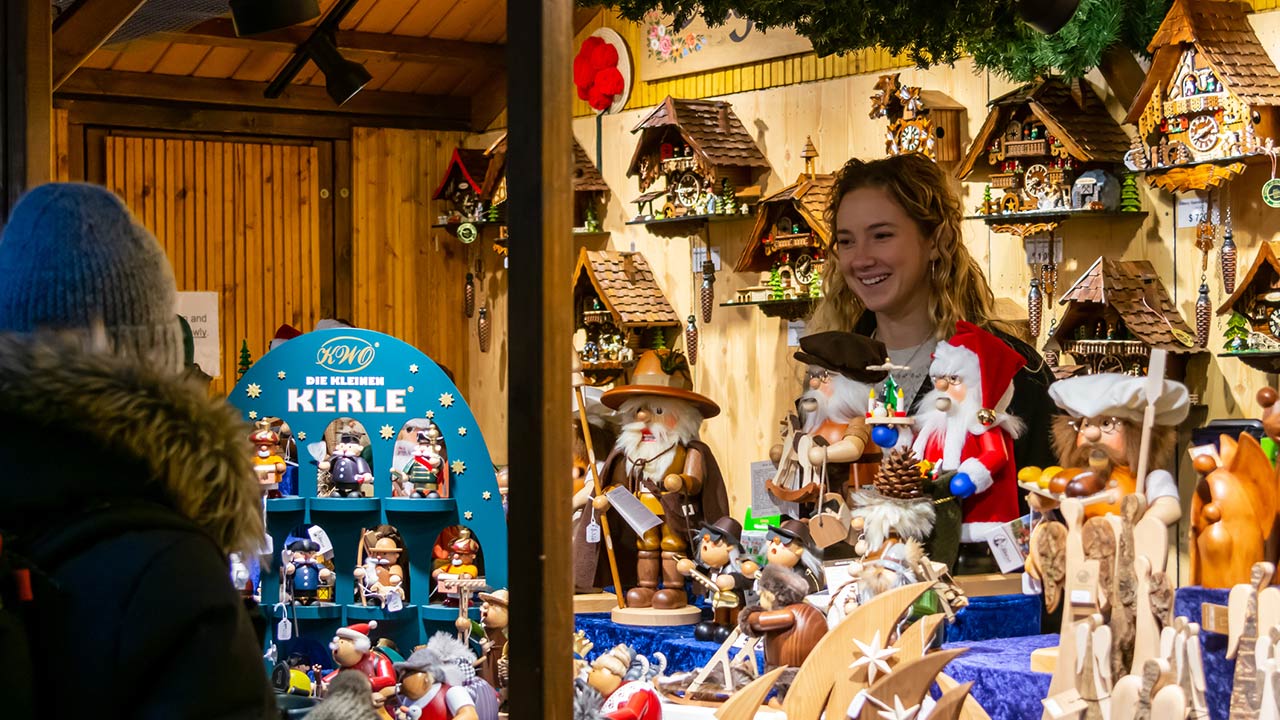 Shopkeeper selling Christmas-themed goods at the Christkindlmarket at the Daley Plaza in Chicago