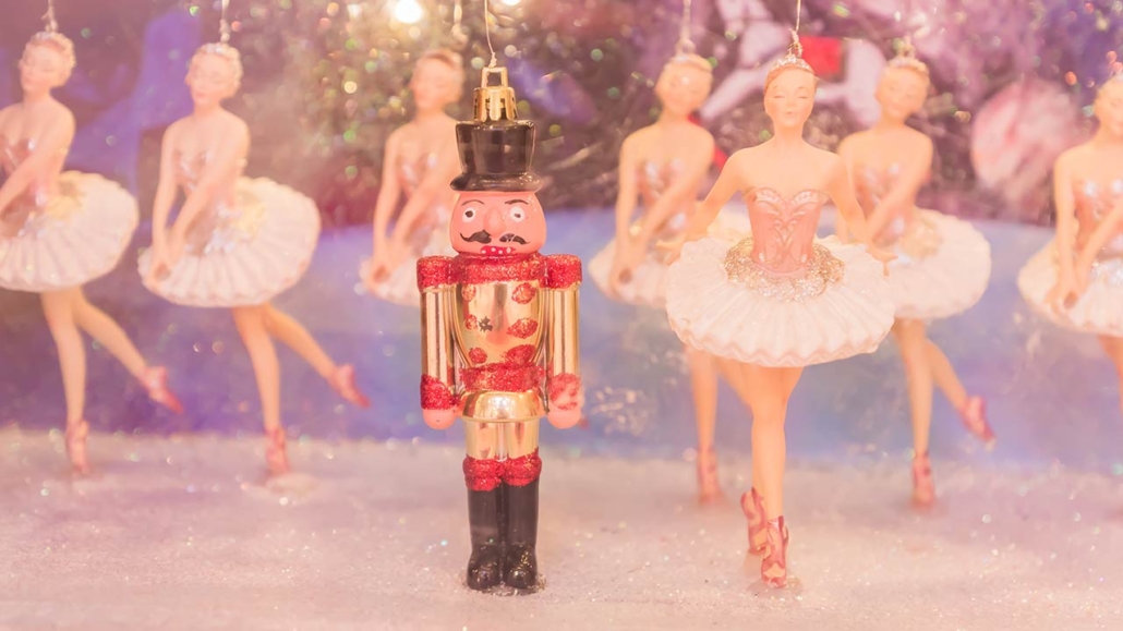 Christmas Nutcracker toy soldier and balerina dolls on the stage