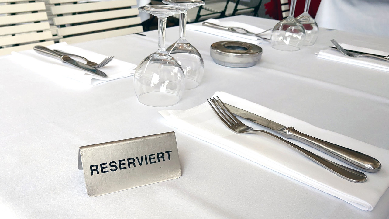 A sign with the inscription reserved on a table in a cafe or restaurant