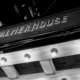 In black and white, a low angle view of the Palmer House name in Chicago