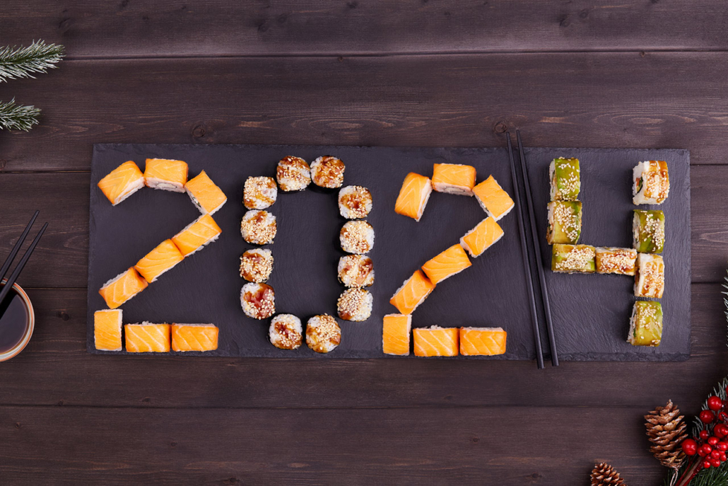 Sushi rolls laid out in numbers reading 2024