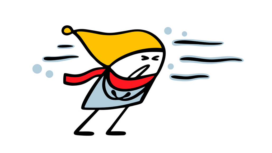 Unhappy doodle boy in a warm jacket, scarf and coat walks through a blizzard and snowfall