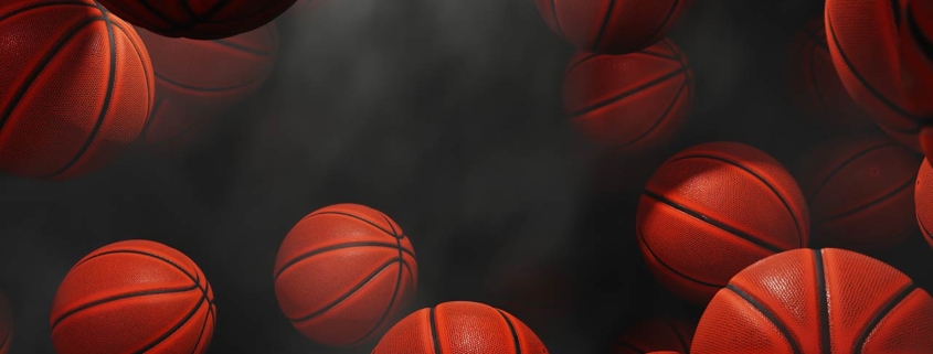 3D illustration of basketballs on a black background