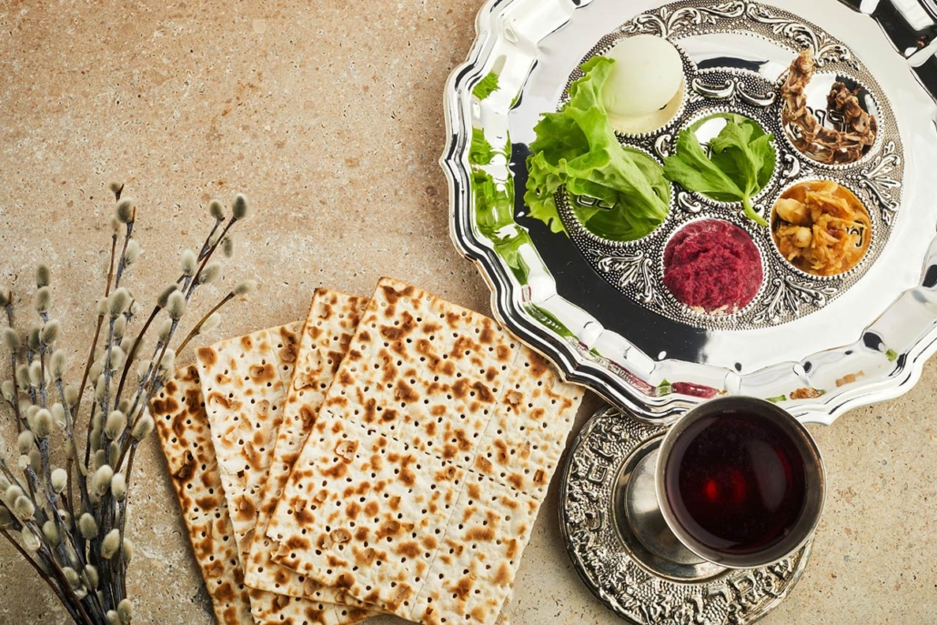 passover seder plate with traditional food on stone background