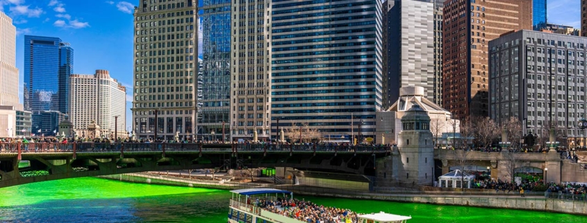chicago river walk with green color dyeing river in downtown with irish and american people are celebrating