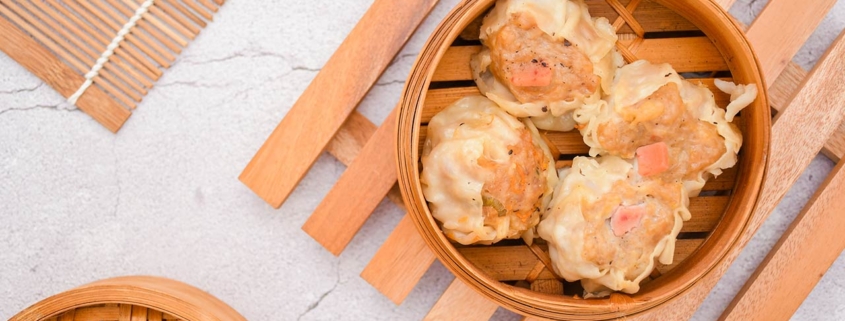 Fresh dimsum siu mai in a bamboo steamer
