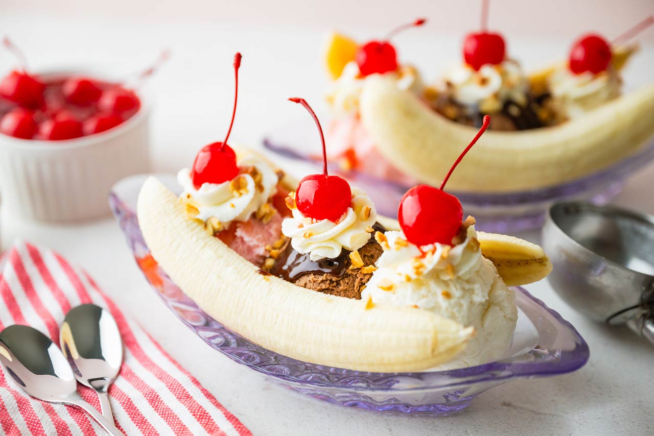 banana split with cherries and nuts stock photo