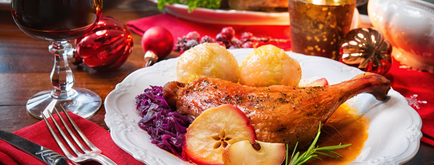 Roast duck with dumplings, red cabbage and apples