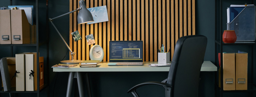 Organized Home Office With Stylish Wooden Backdrop stock photo