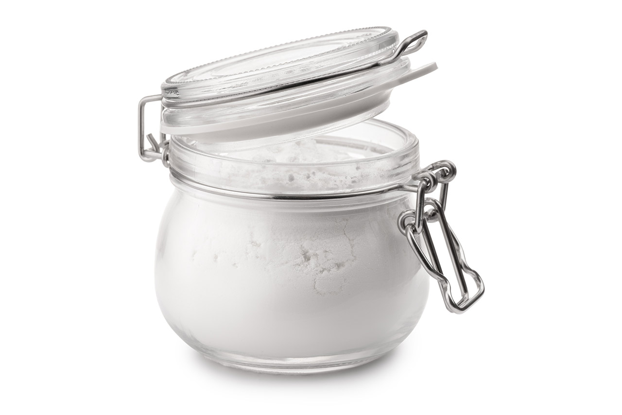 Glass jar of corn starch stock photo