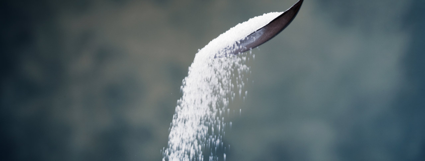 sugar on a spoon stock photo
