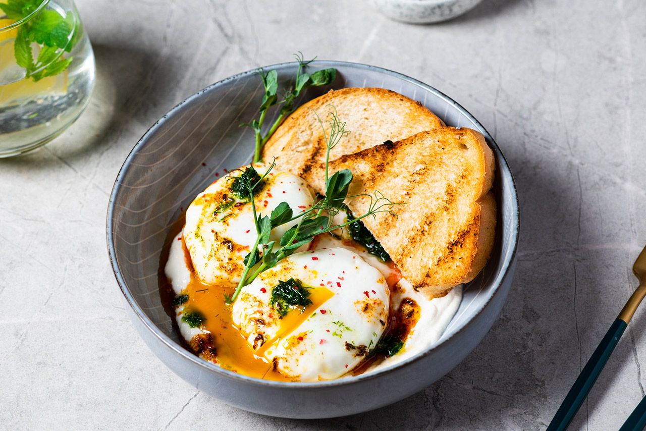Turkish breakfast in a grey bowl on marble background stock photo