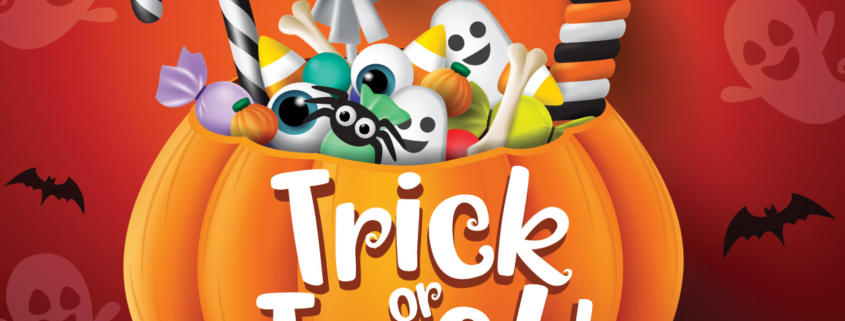 Trick or treat halloween pumpkin basket with sweets and scary candies stock photo