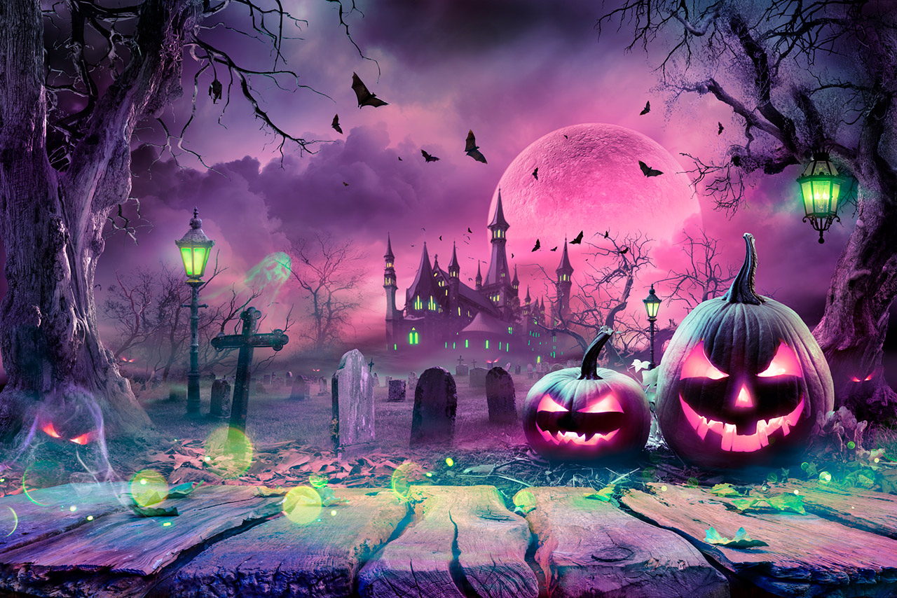 Halloween Pumpkins In Spooky Night With Purple Moon And Cemetery stock photo